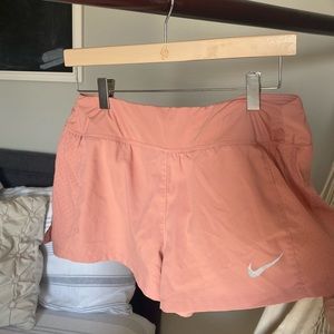 Coral Nike dri-fit running shorts